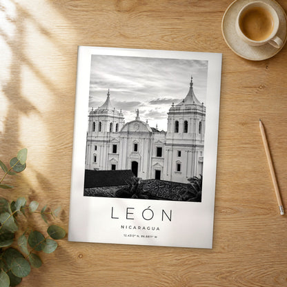Unframed León black and white travel poster on a wooden table