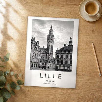 Unframed Lille black and white travel poster on a wooden table