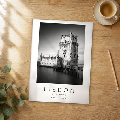 Unframed Lisbon black and white travel poster on a wooden table