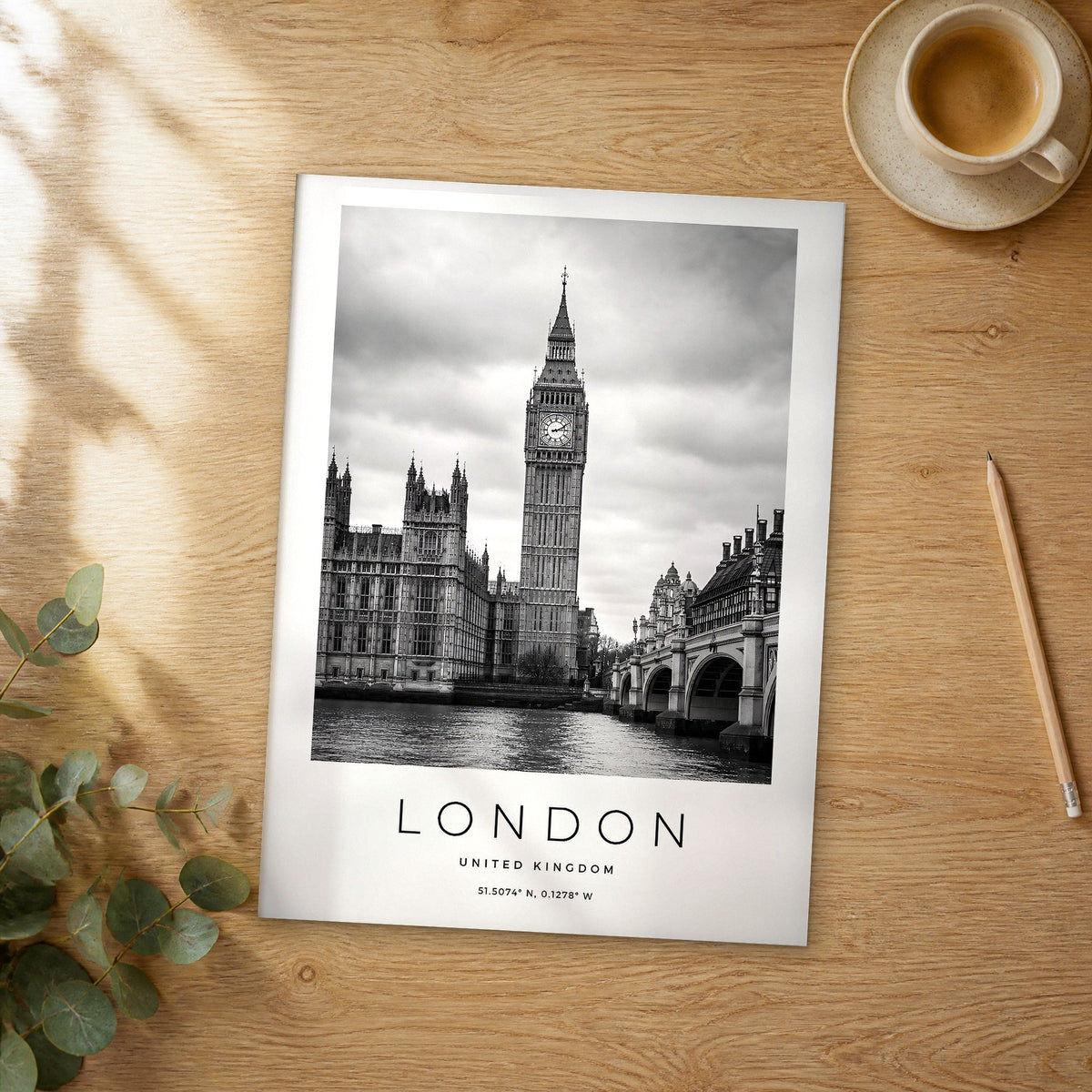 Unframed London black and white travel poster on a wooden table