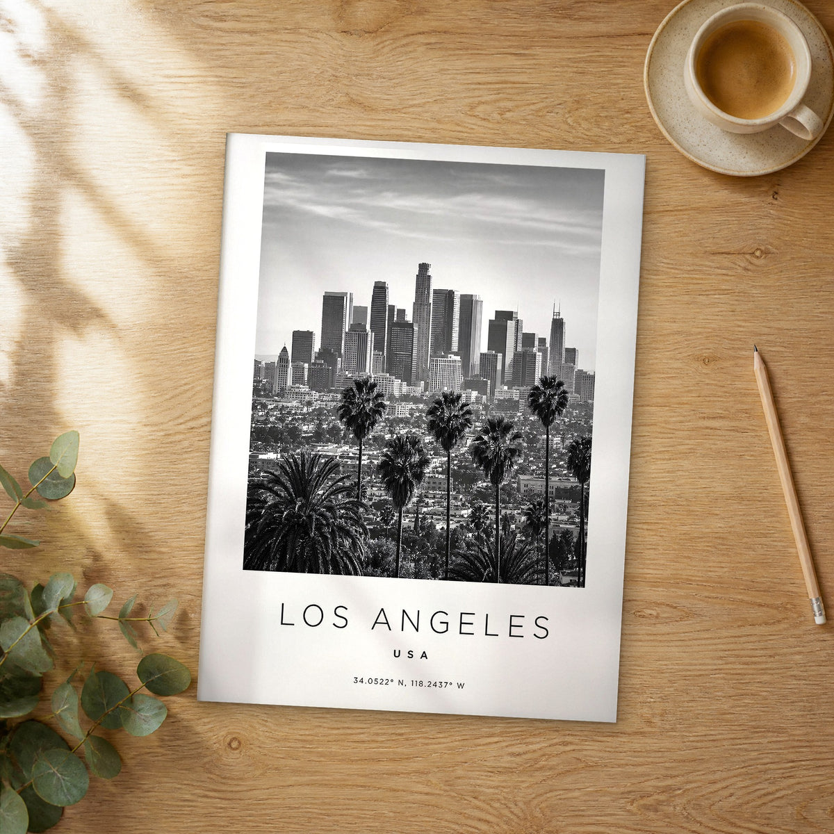 Unframed Los Angeles black and white travel poster on a wooden table