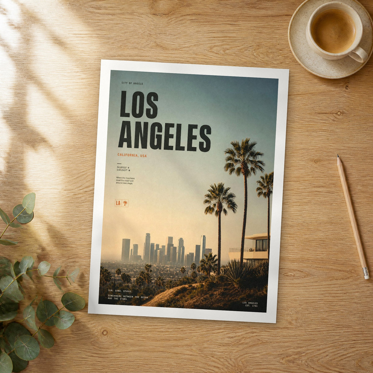 Unframed Los Angeles bold typography travel poster on a wooden table