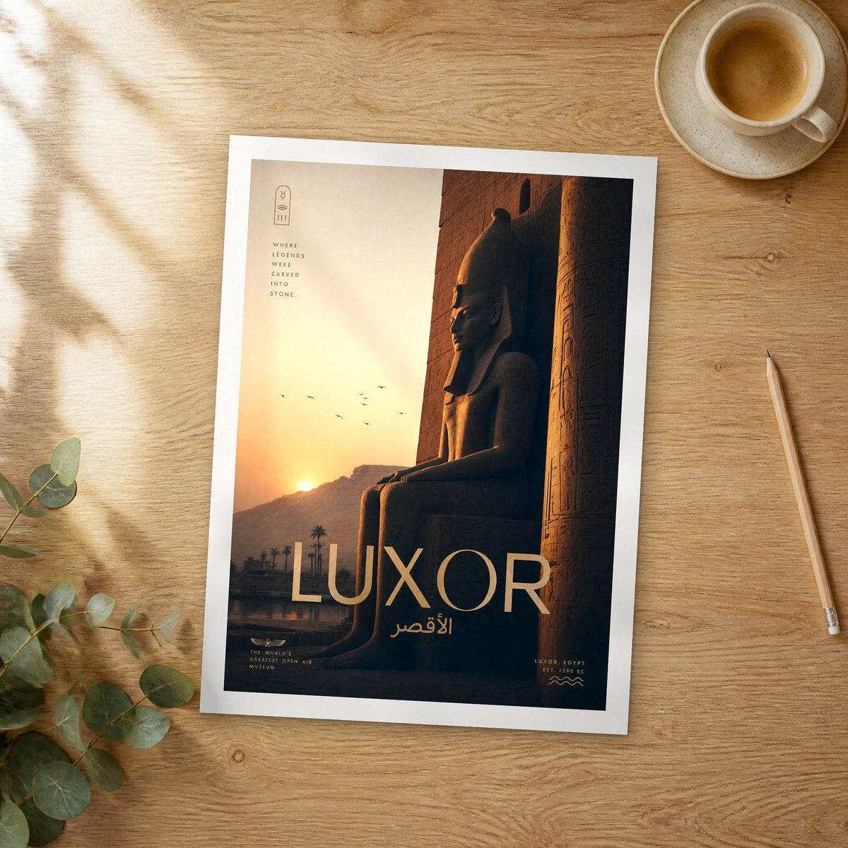 Unframed Luxor bold typography travel poster on a wooden table