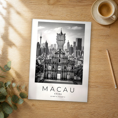 Unframed Macau black and white travel poster on a wooden table
