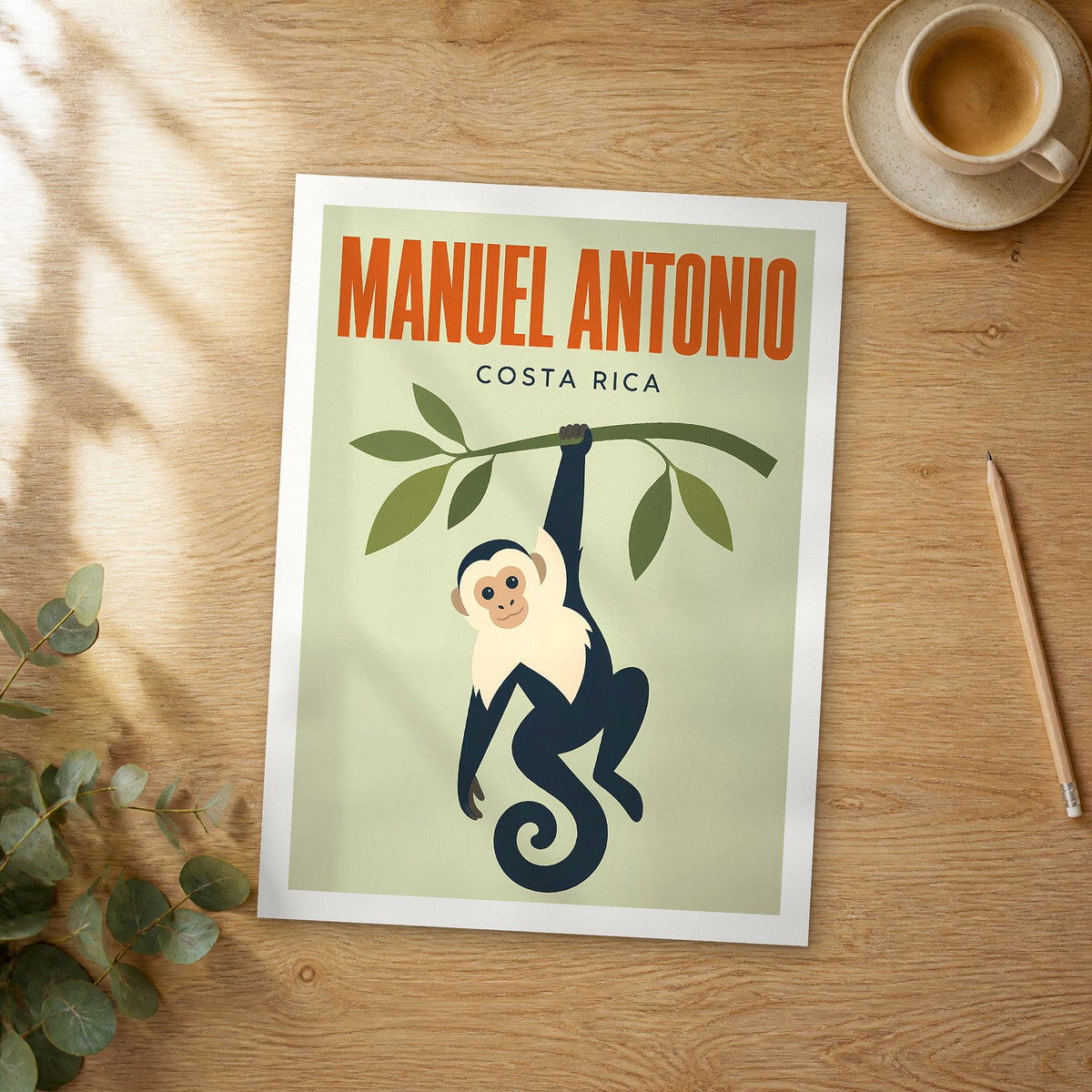 Unframed Manuel Antonio pop art travel poster on a wooden table