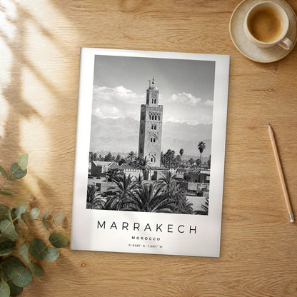 Unframed Marrakech black and white travel poster on a wooden table