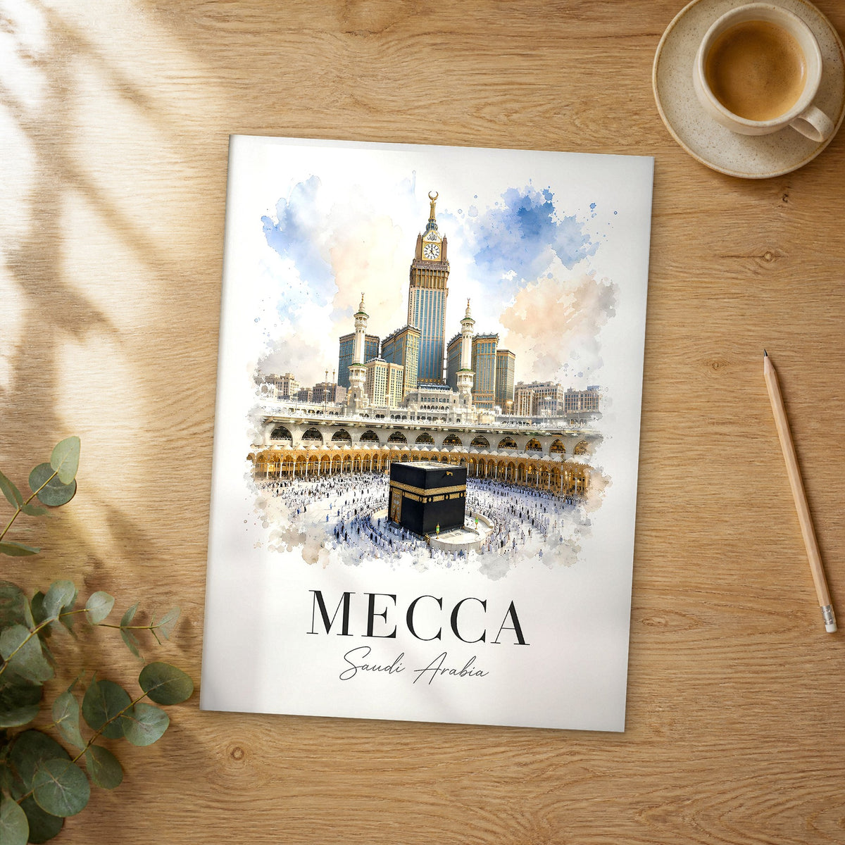 Unframed Mecca Kaaba and Clock Tower watercolor travel poster on a wooden table
