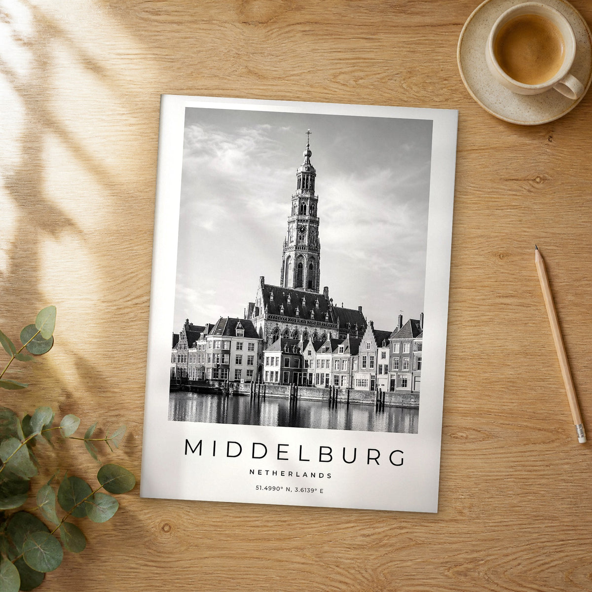 Unframed Middelburg black and white travel poster on a wooden table
