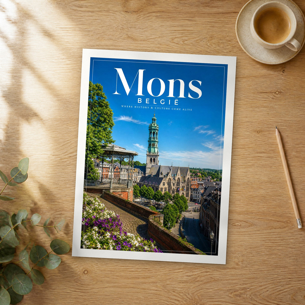 Unframed Mons editorial travel poster on a wooden table