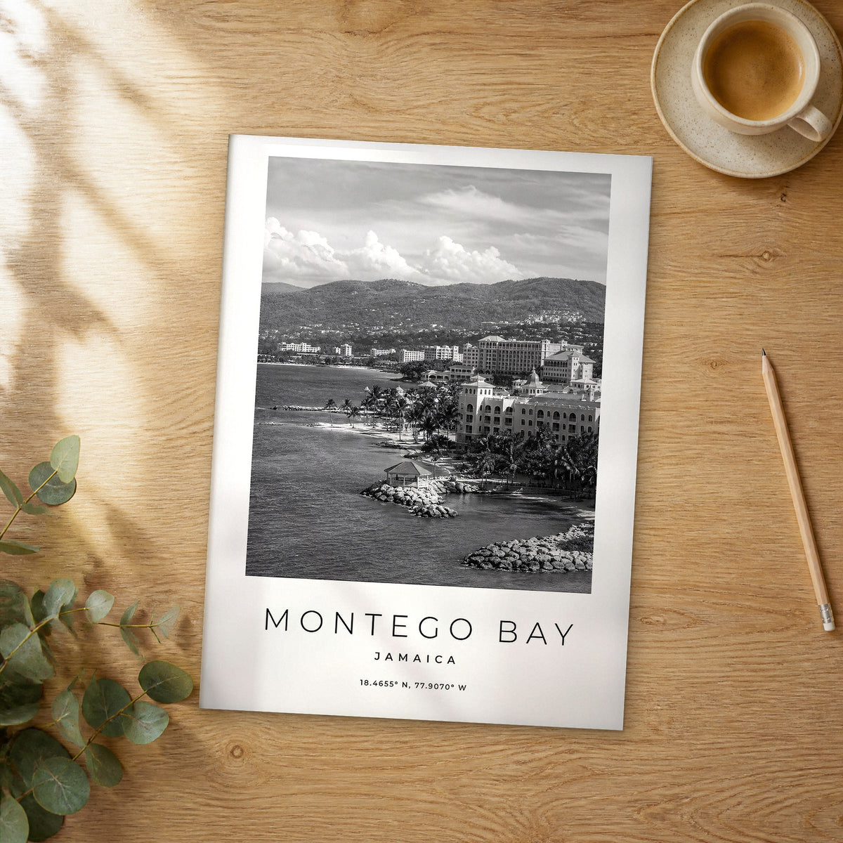 Unframed Montego Bay black and white travel poster on a wooden table