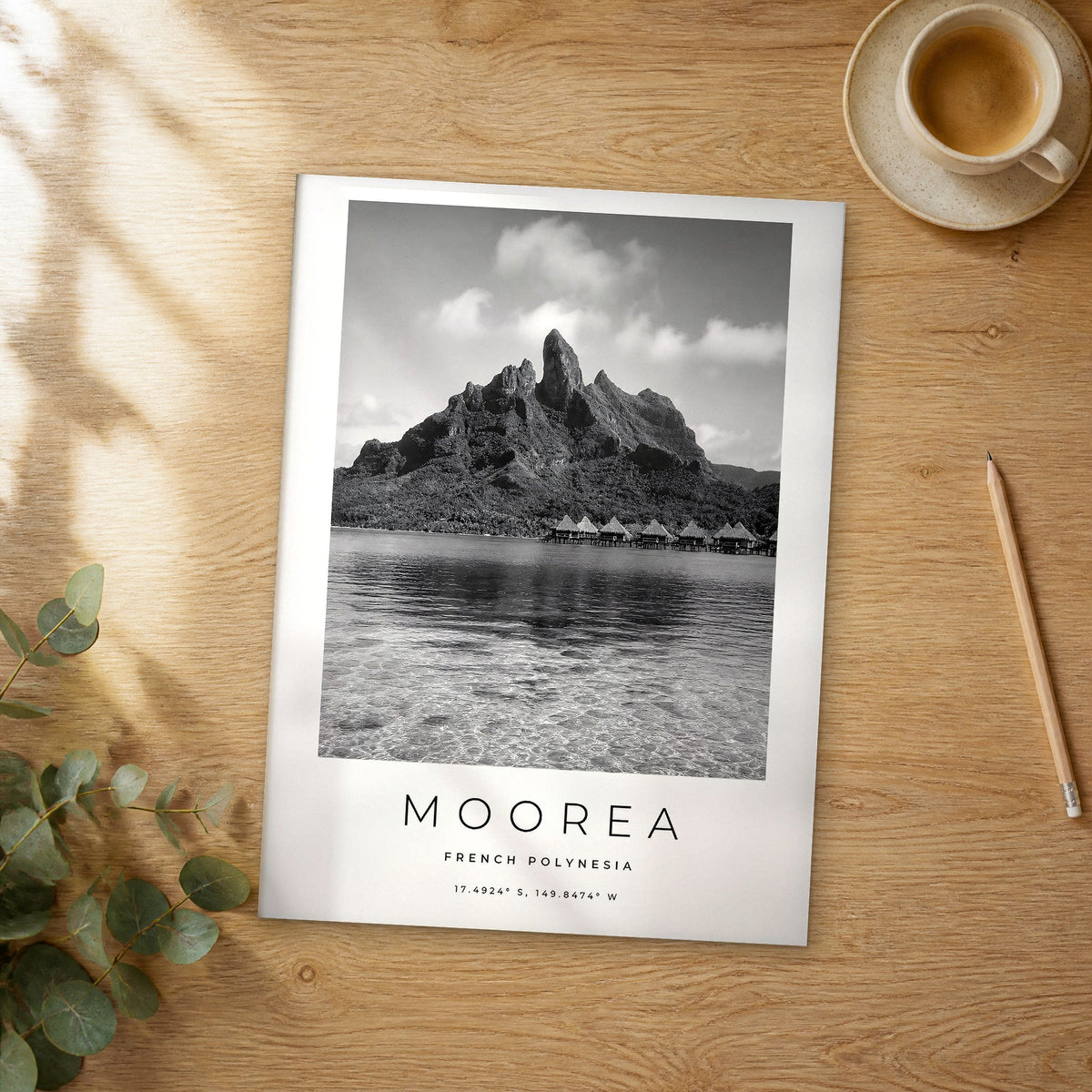 Unframed Moorea black and white travel poster on a wooden table