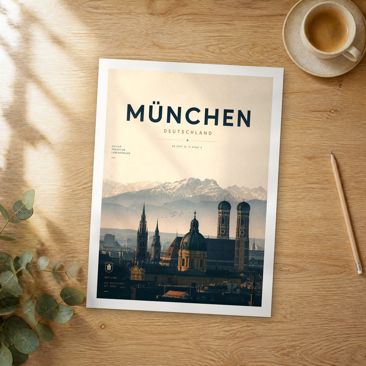 Unframed München bold typography travel poster on a wooden table