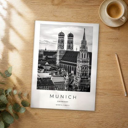 Unframed Munich black and white travel poster on a wooden table