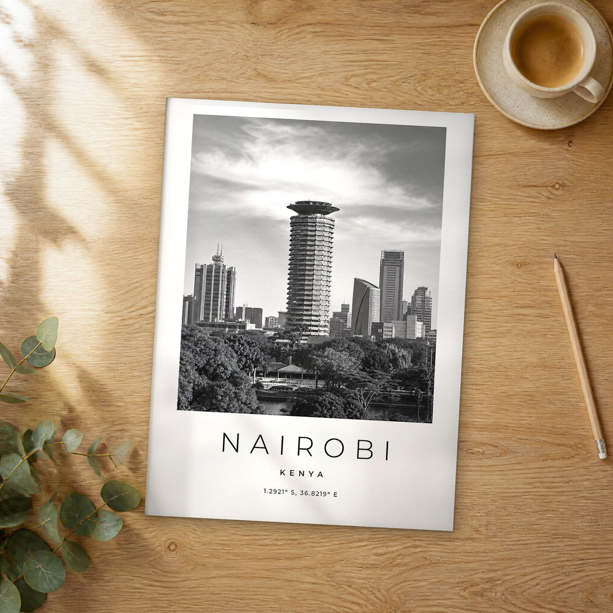 Unframed Nairobi black and white travel poster on a wooden table
