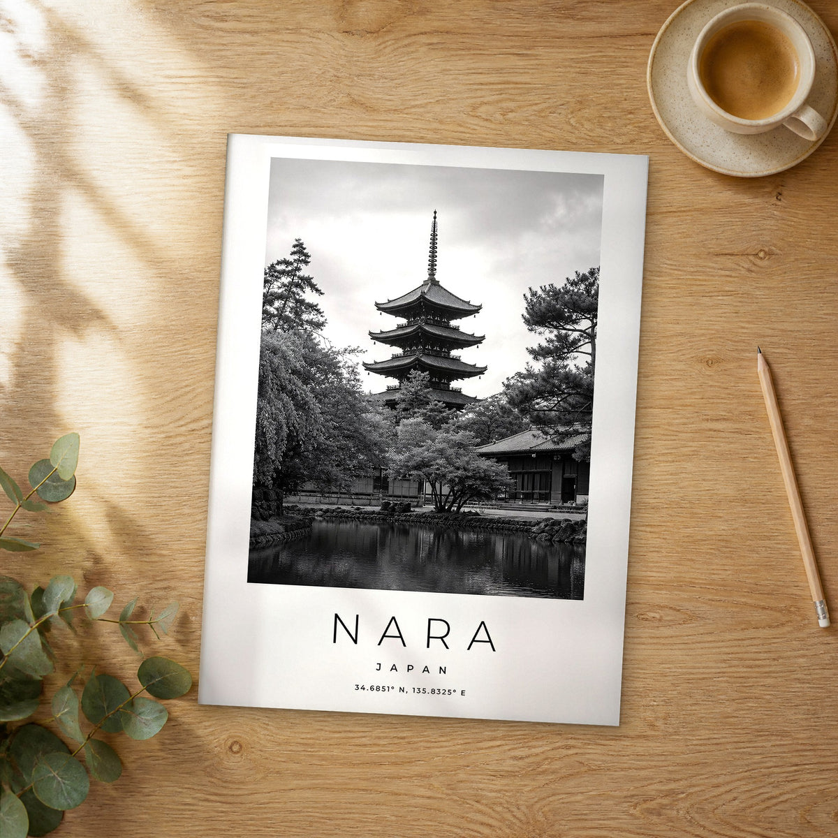 Unframed Nara black and white travel poster on a wooden table