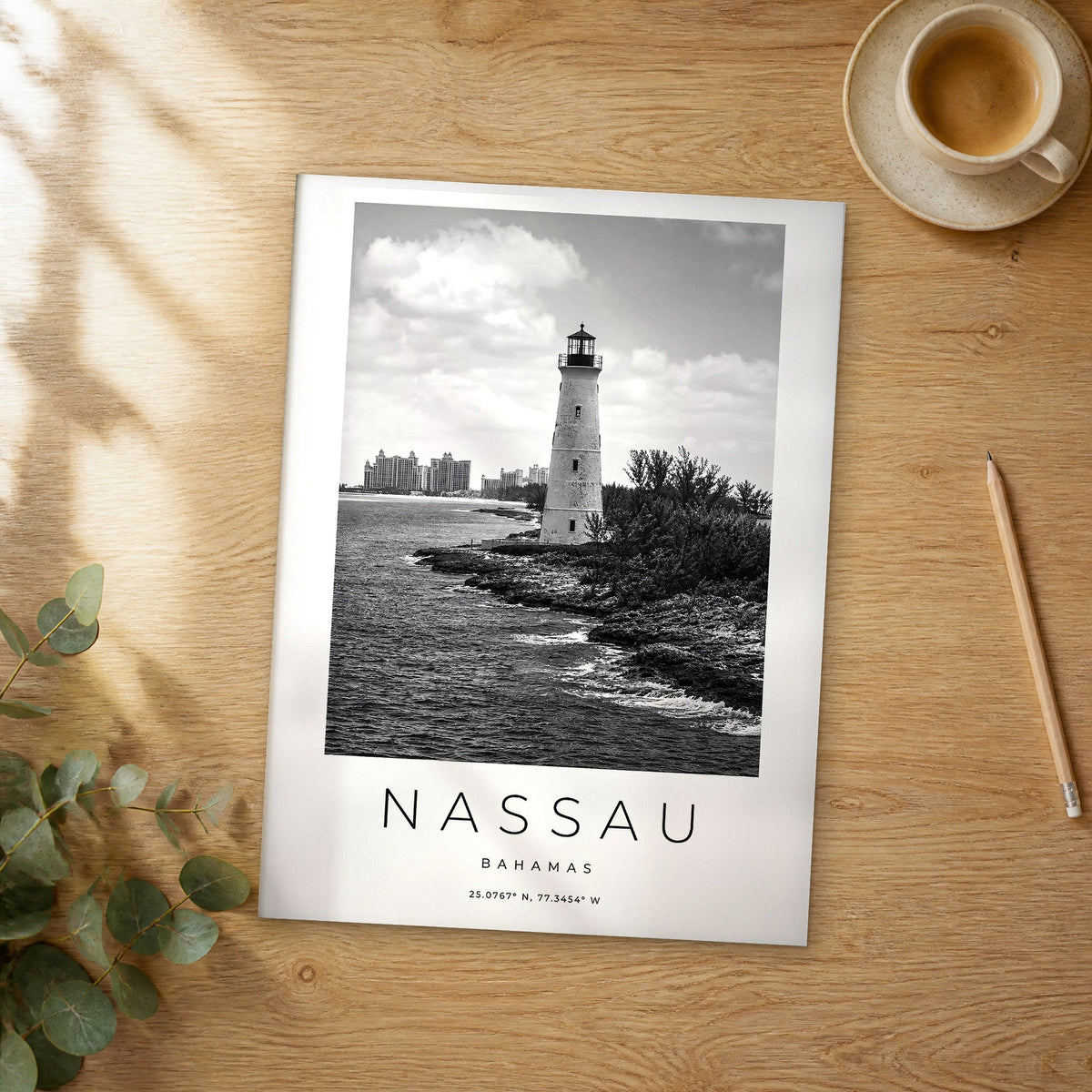 Unframed Nassau black and white travel poster on a wooden table