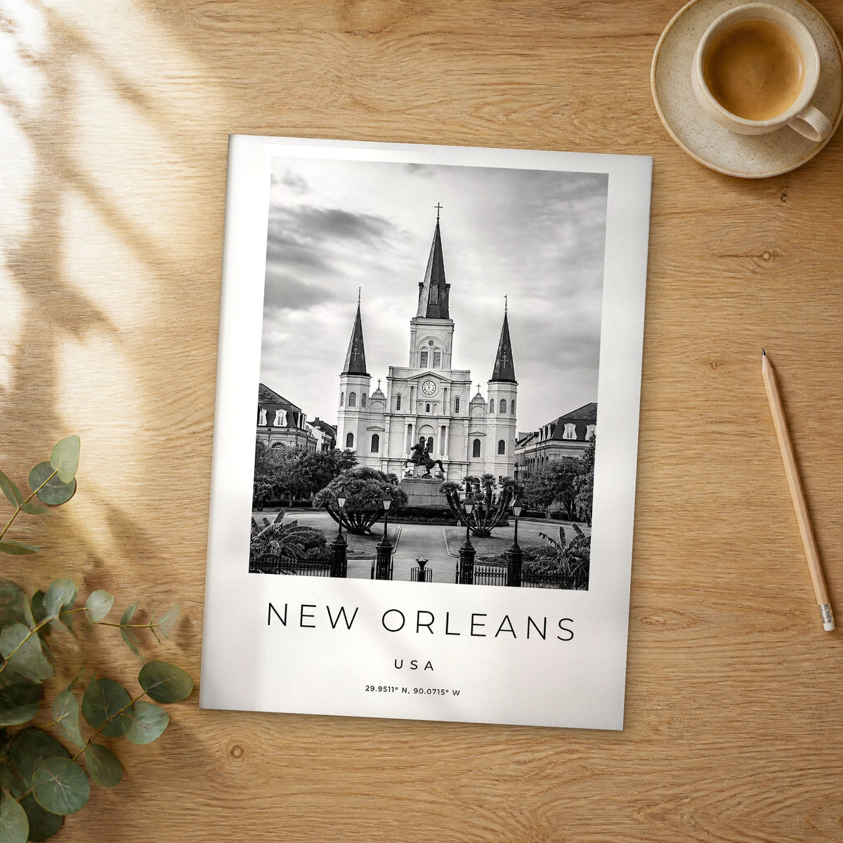 Unframed New Orleans black and white travel poster on a wooden table