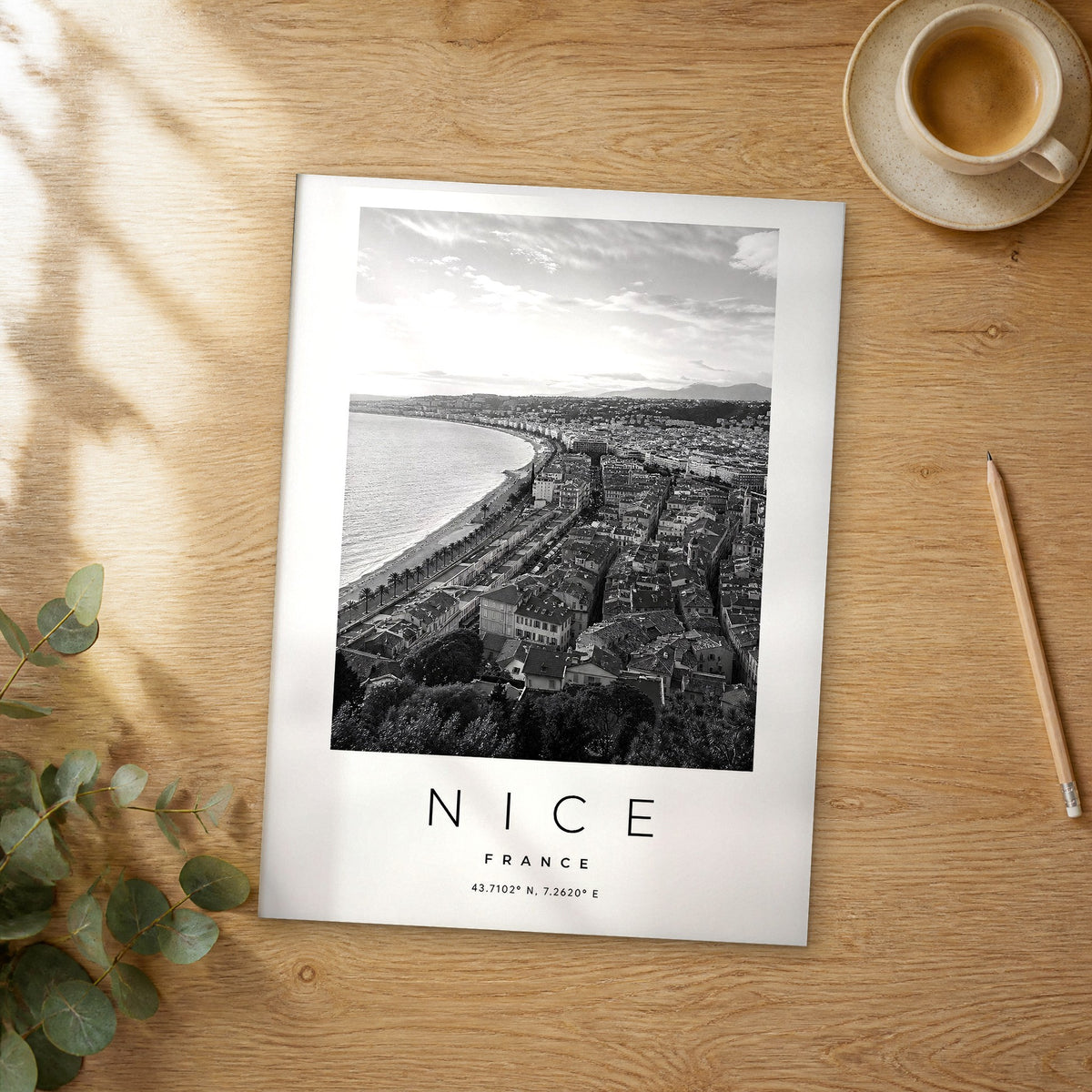 Unframed Nice black and white travel poster on a wooden table