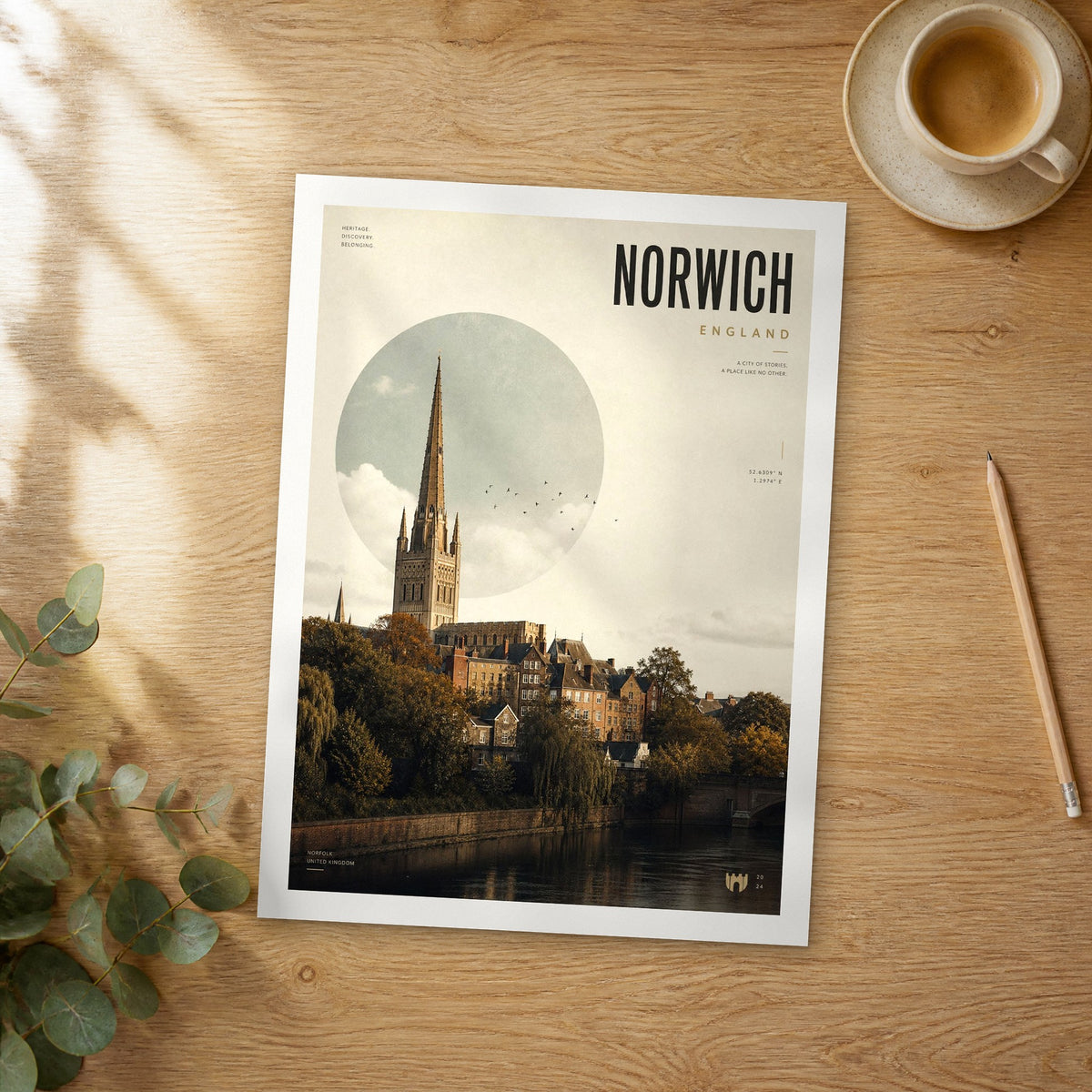 Unframed Norwich bold typography travel poster on a wooden table