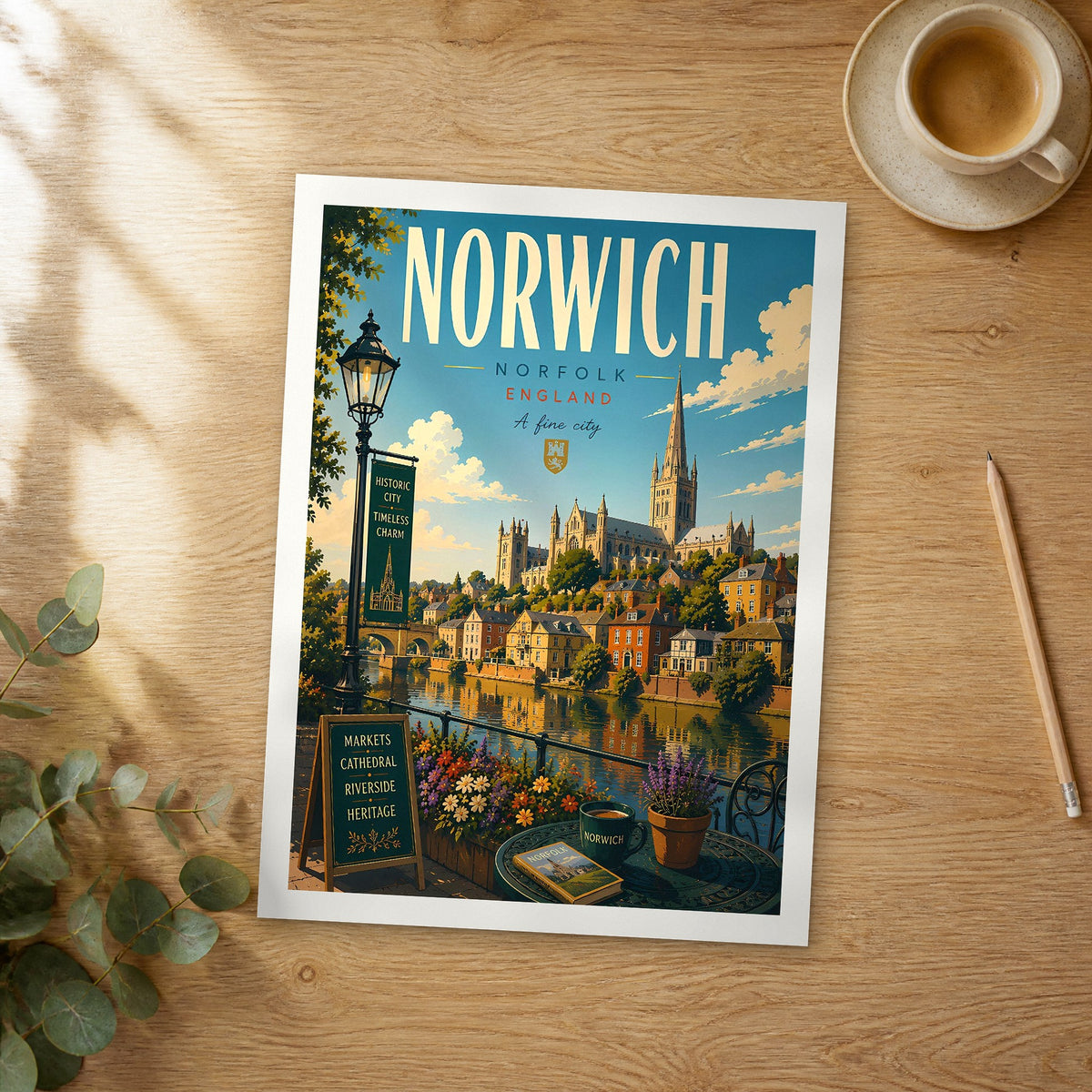 Unframed Norwich retro travel poster on a wooden table
