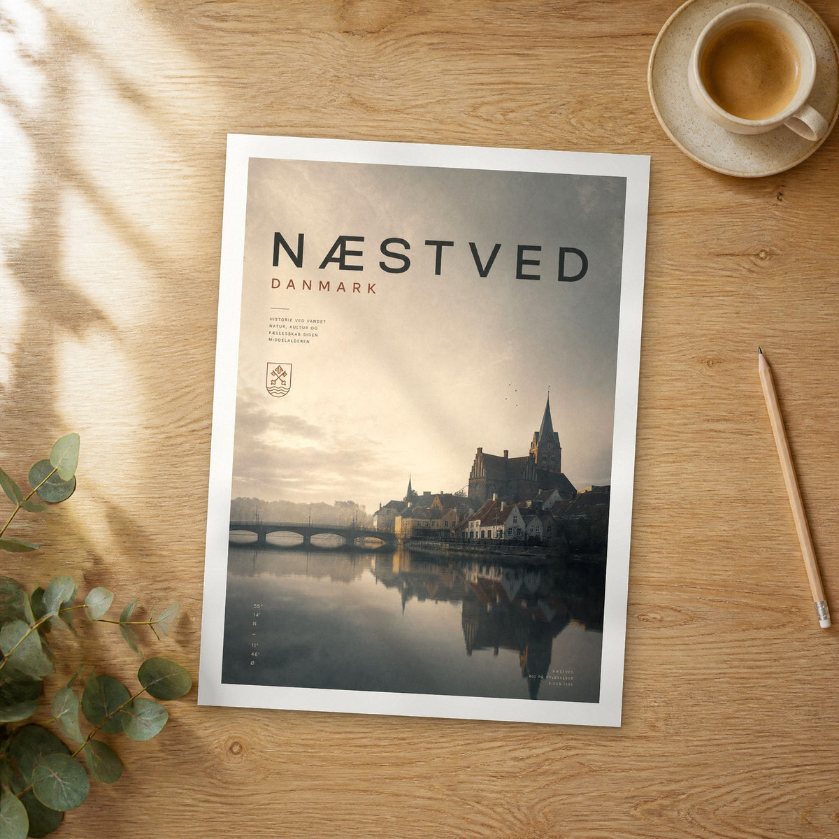 Unframed Næstved bold typography travel poster on a wooden table