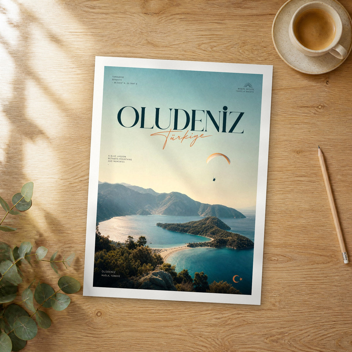 Unframed Oludeniz bold typography travel poster on a wooden table