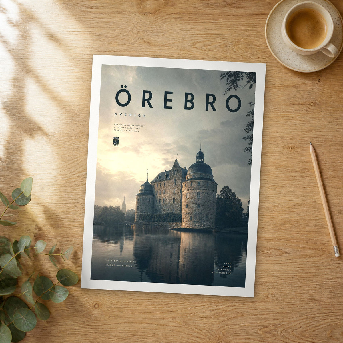 Unframed Örebro bold typography travel poster on a wooden table
