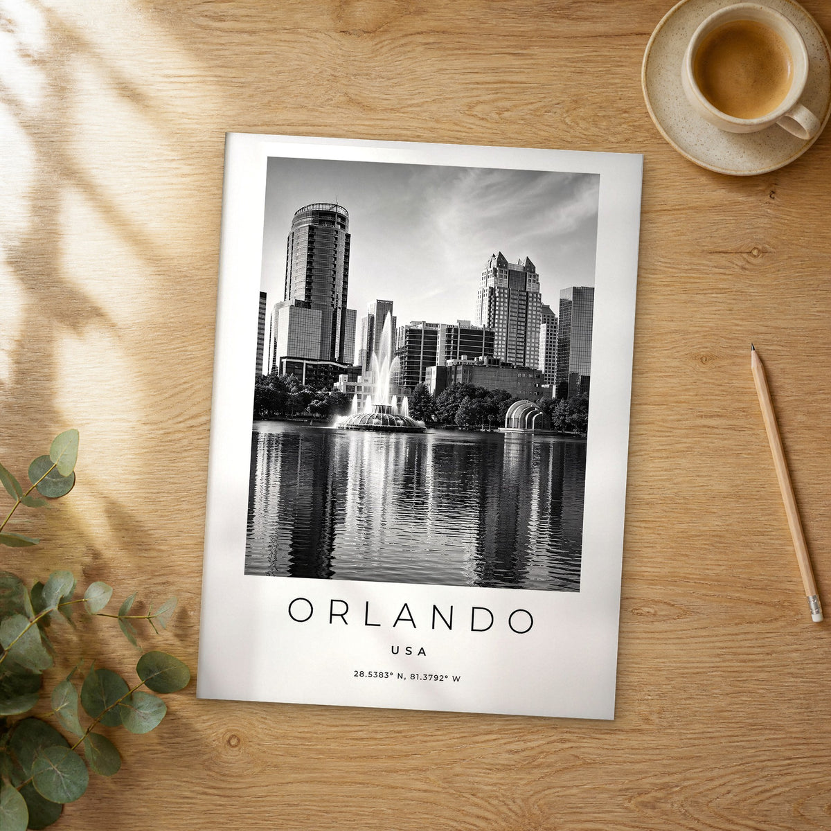 Unframed Orlando black and white travel poster on a wooden table