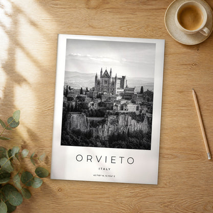Unframed Orvieto black and white travel poster on a wooden table