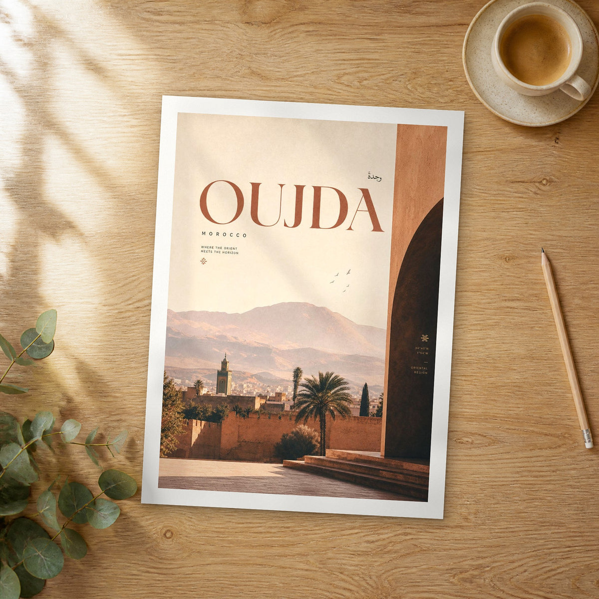 Unframed Oujda bold typography travel poster on a wooden table