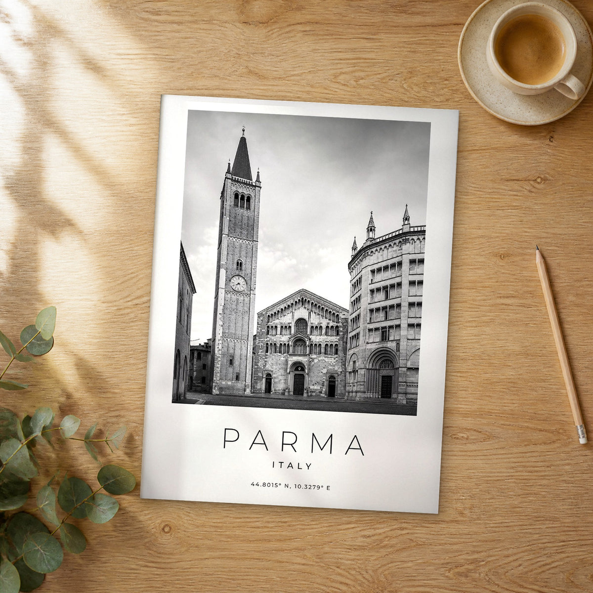 Unframed Parma black and white travel poster on a wooden table