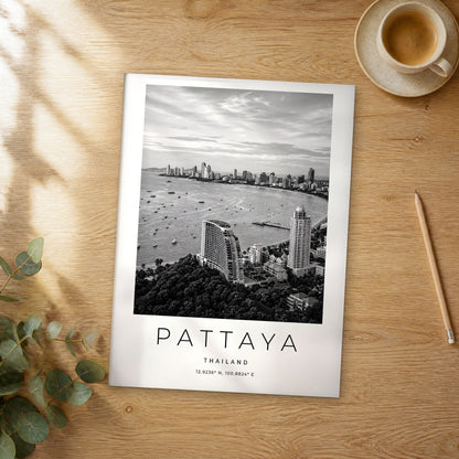 Unframed Pattaya black and white travel poster on a wooden table