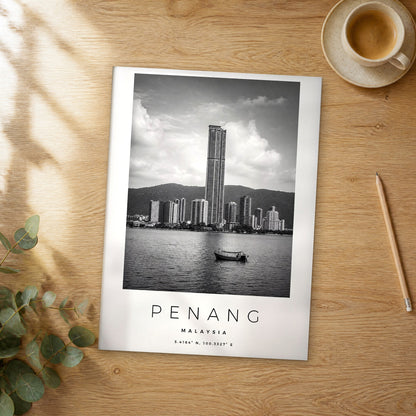 Unframed Penang black and white travel poster on a wooden table