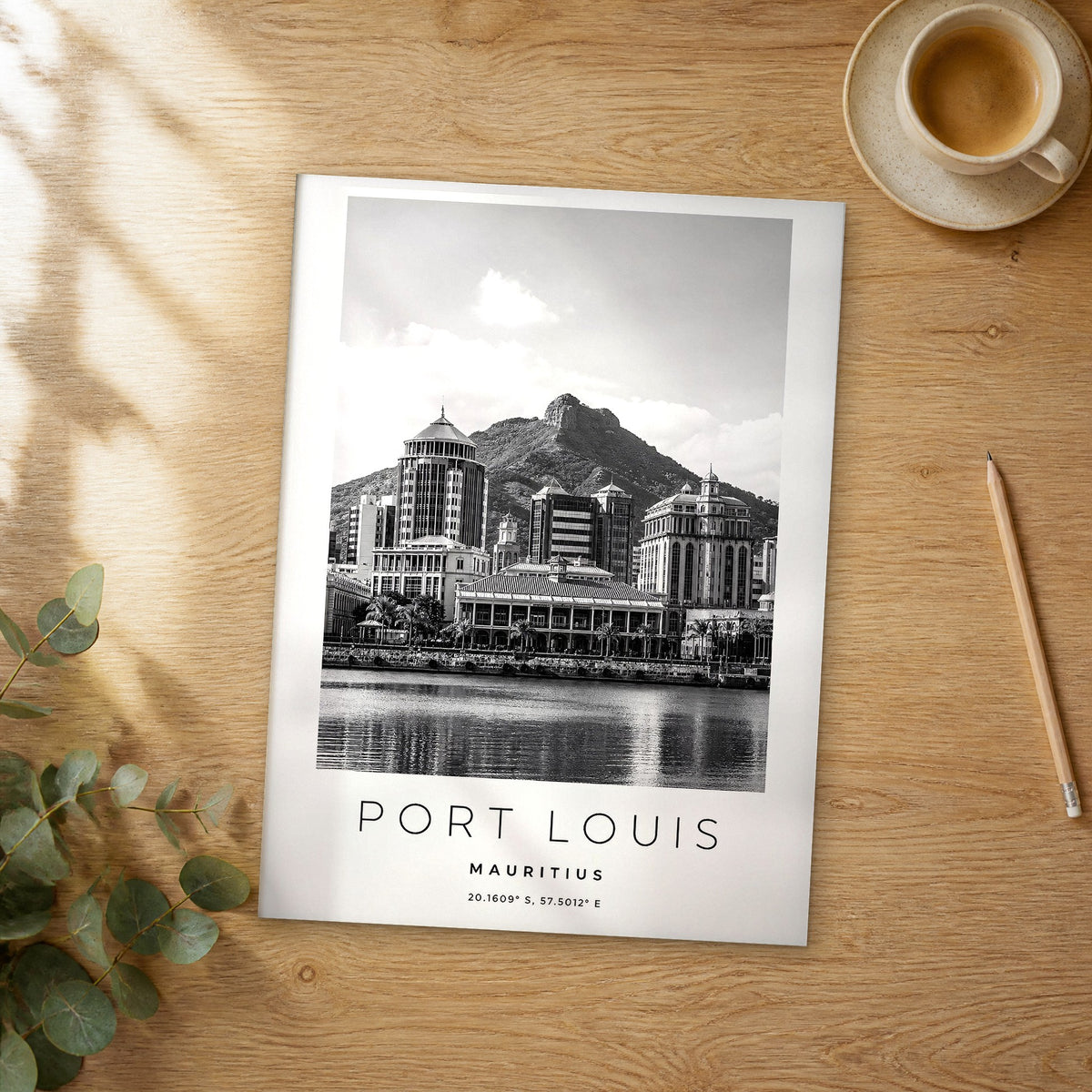 Unframed Port Louis black and white travel poster on a wooden table