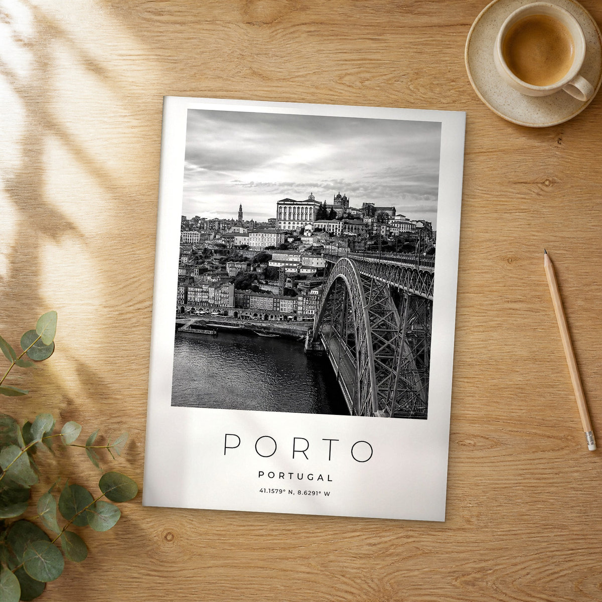 Unframed Porto black and white travel poster on a wooden table