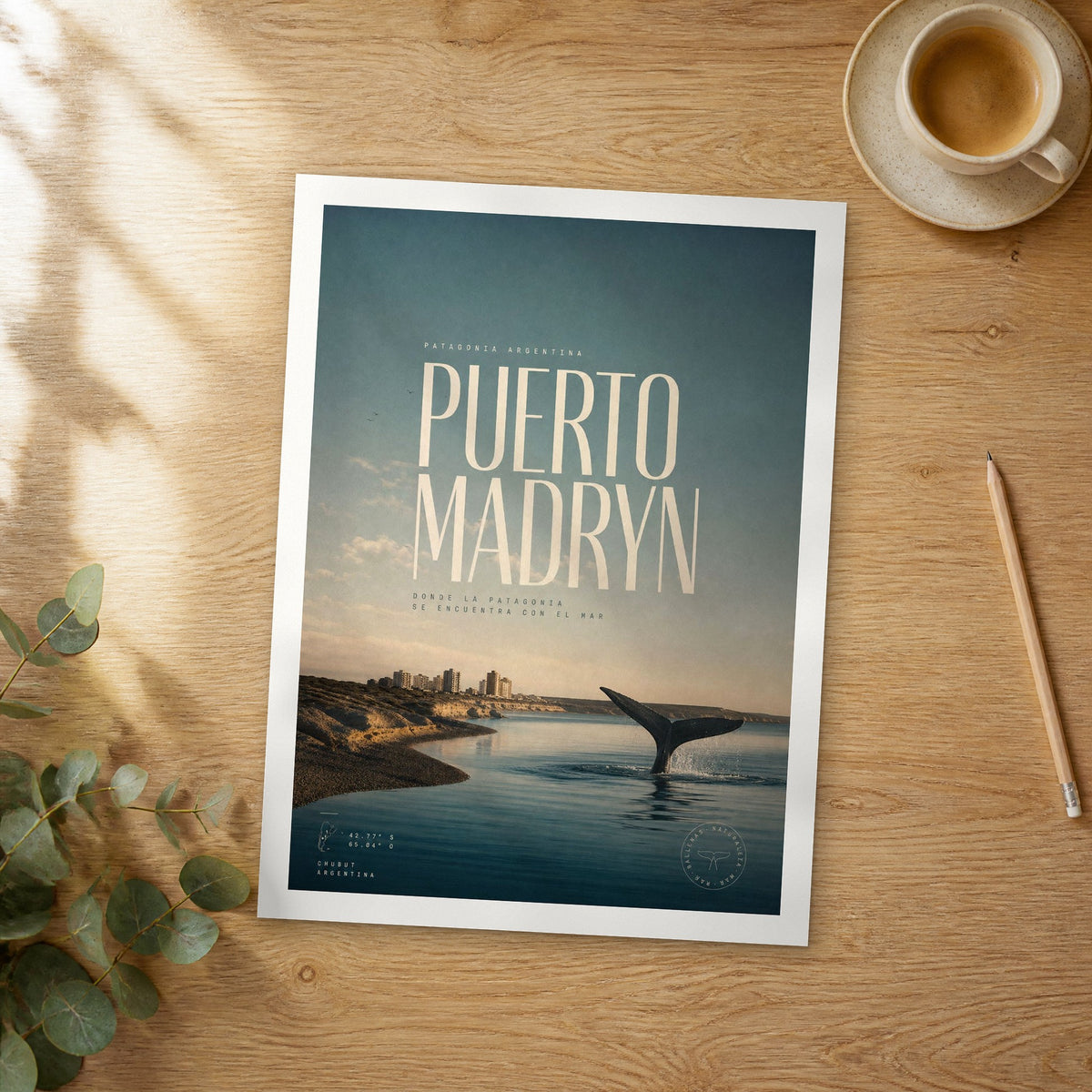 Unframed Puerto Madryn bold typography travel poster on a wooden table