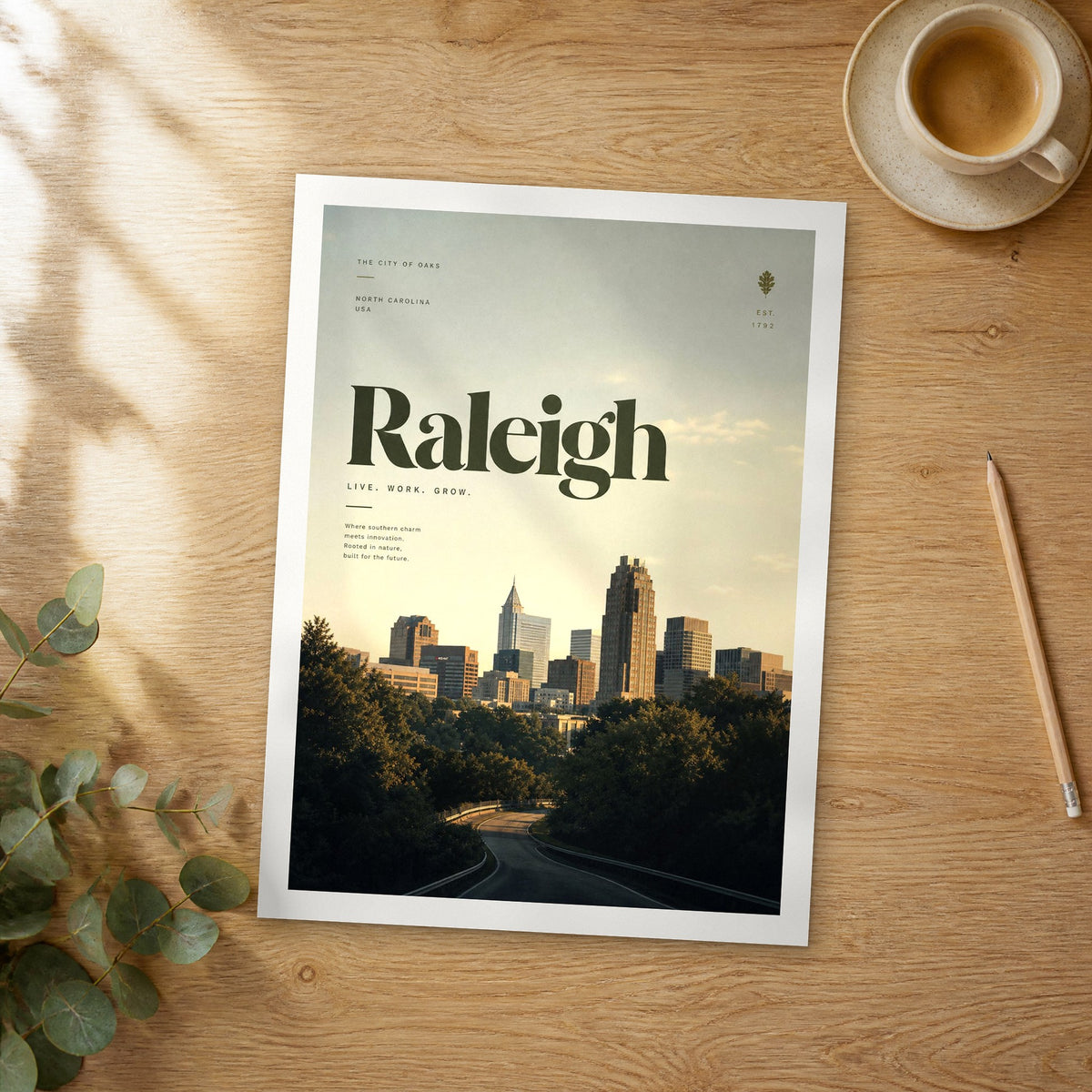 Unframed Raleigh bold typography travel poster on a wooden table