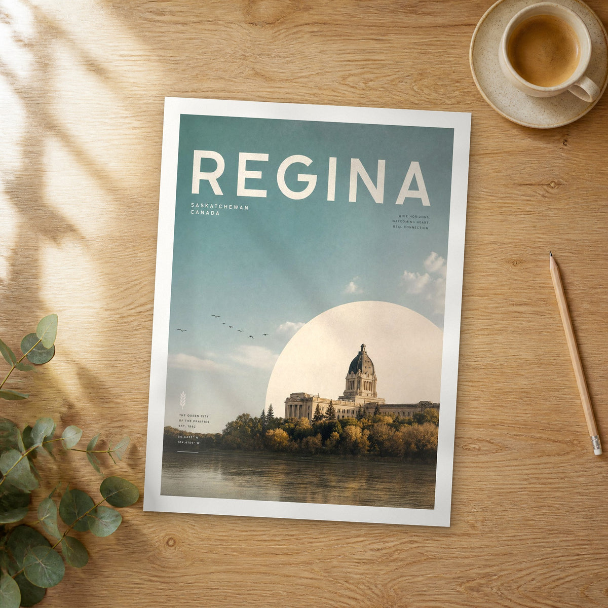 Unframed Regina bold typography travel poster on a wooden table