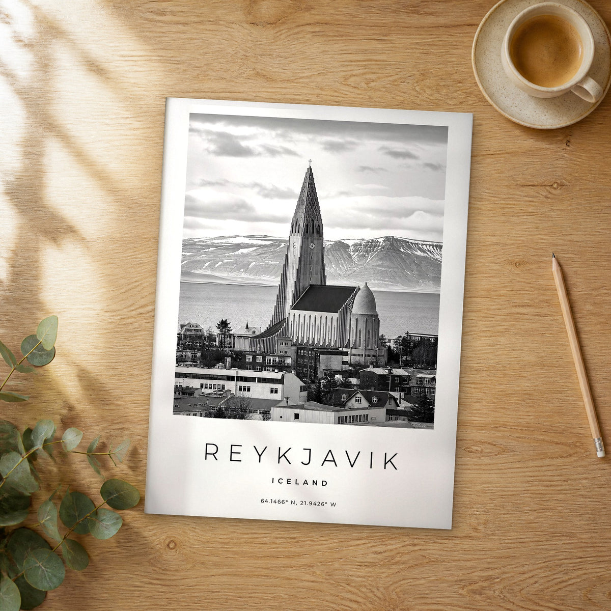 Unframed Reykjavik black and white travel poster on a wooden table