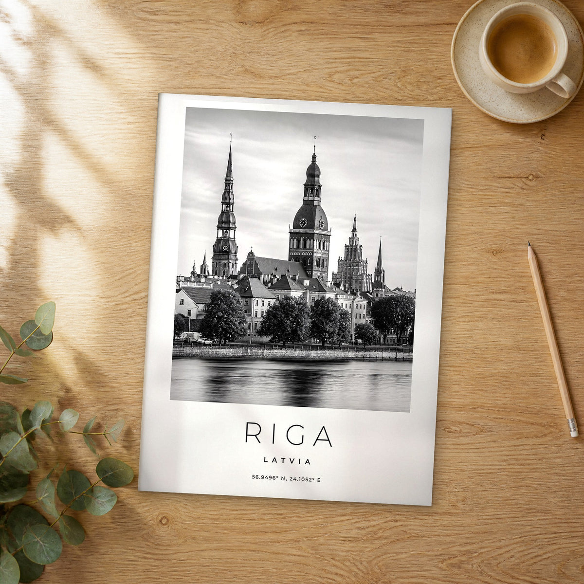 Unframed Riga black and white travel poster on a wooden table