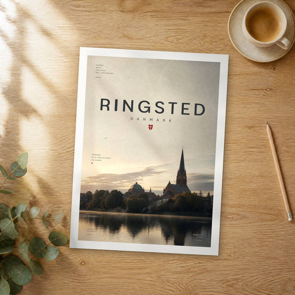 Unframed Ringsted bold typography travel poster on a wooden table
