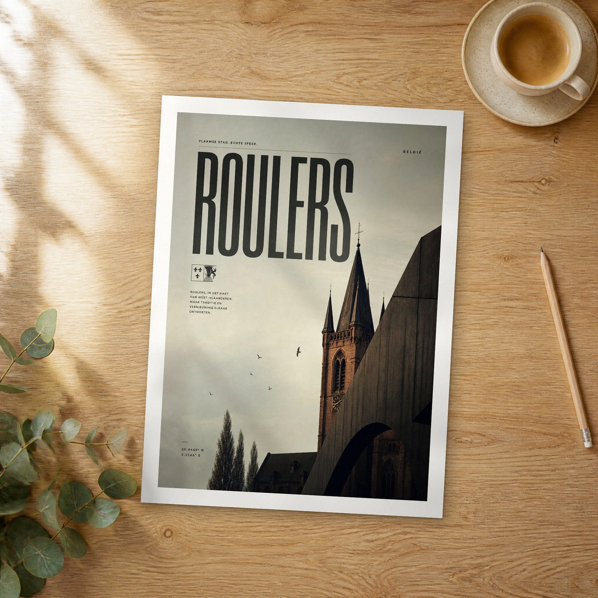 Unframed Roulers bold typography travel poster on a wooden table