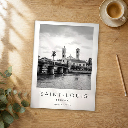 Unframed Saint-Louis black and white travel poster on a wooden table
