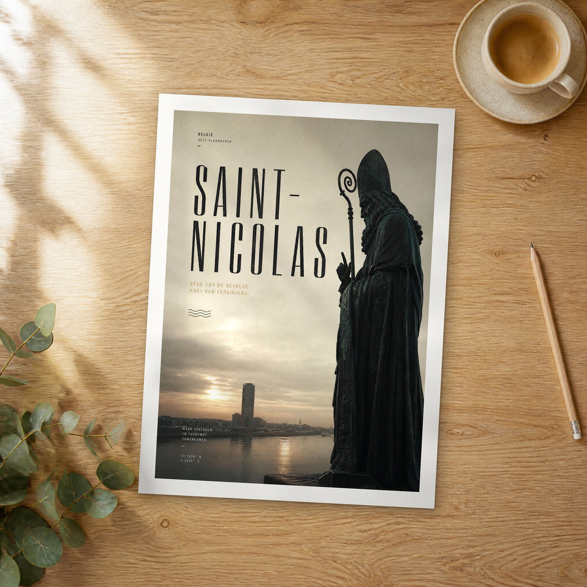 Unframed Saint-Nicolas bold typography travel poster on a wooden table