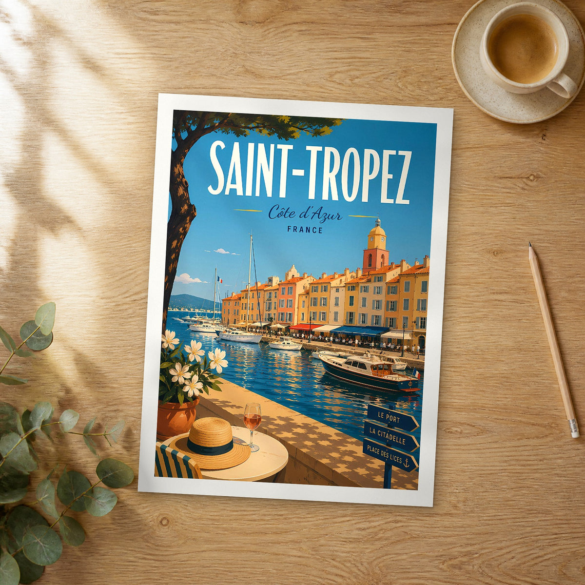 Unframed Saint Tropez retro travel poster on a wooden table