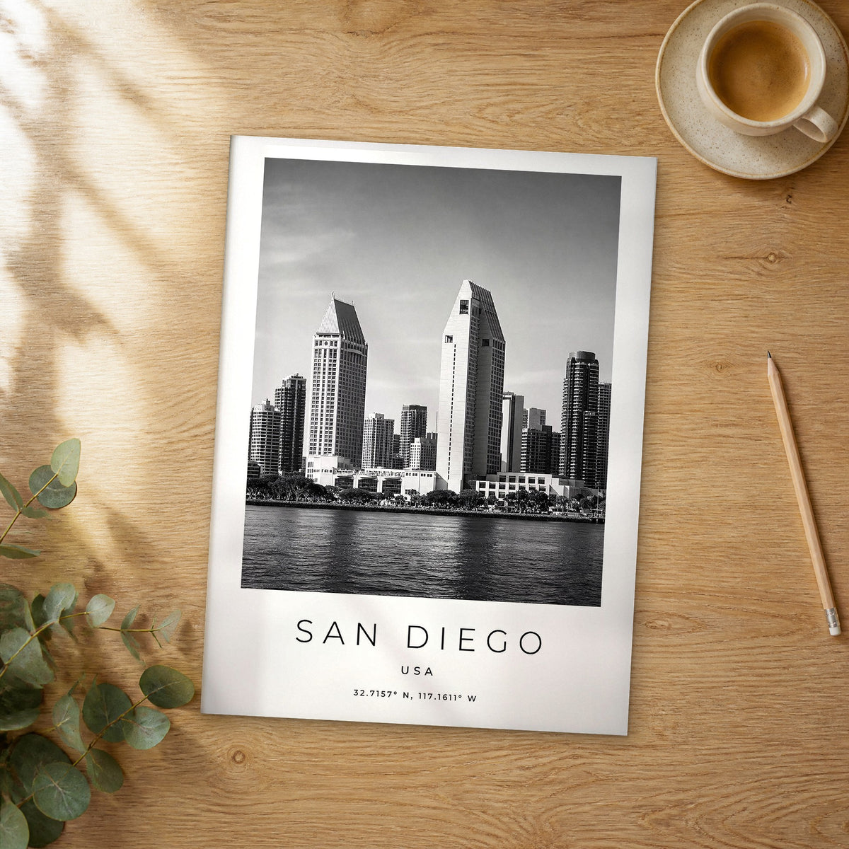 Unframed San Diego black and white travel poster on a wooden table