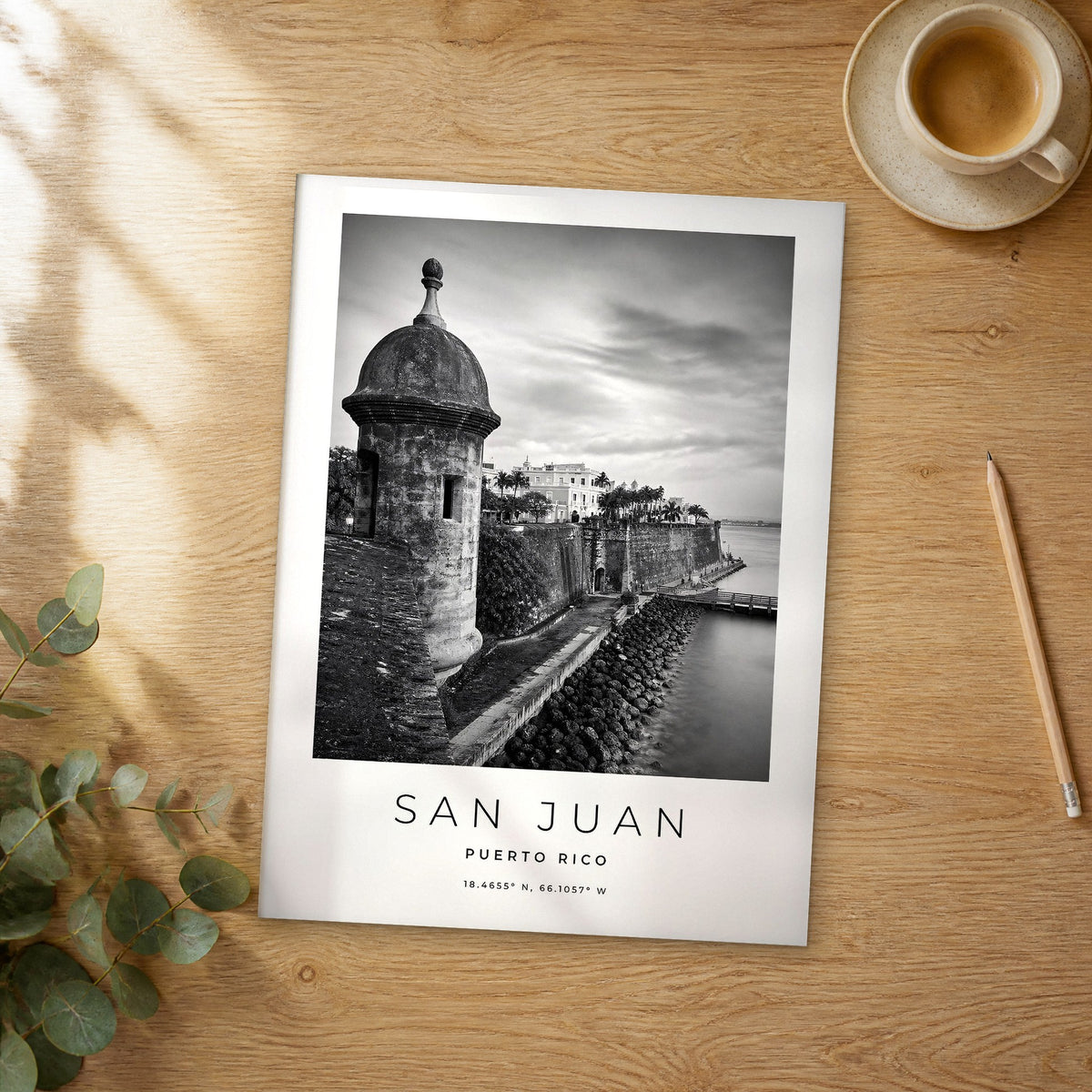 Unframed San Juan black and white travel poster on a wooden table