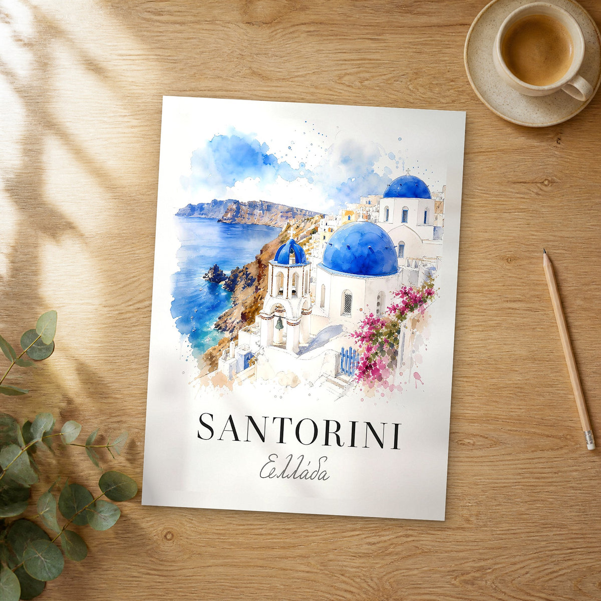 Unframed Santorini Blue Domes of Oia watercolor travel poster on a wooden table