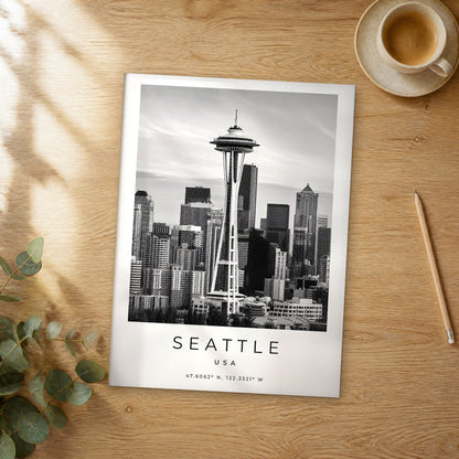 Unframed Seattle black and white travel poster on a wooden table