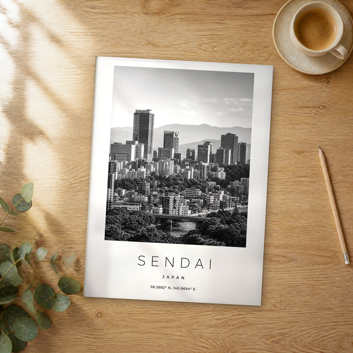 Unframed Sendai black and white travel poster on a wooden table